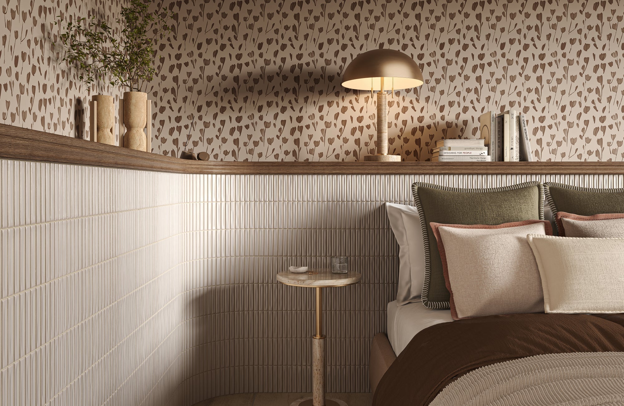 Bedroom with neutral patterned wallpaper and layered decorative pillows in soft earth tones, showing how pillows that blend with furniture create a calm, cohesive look.
