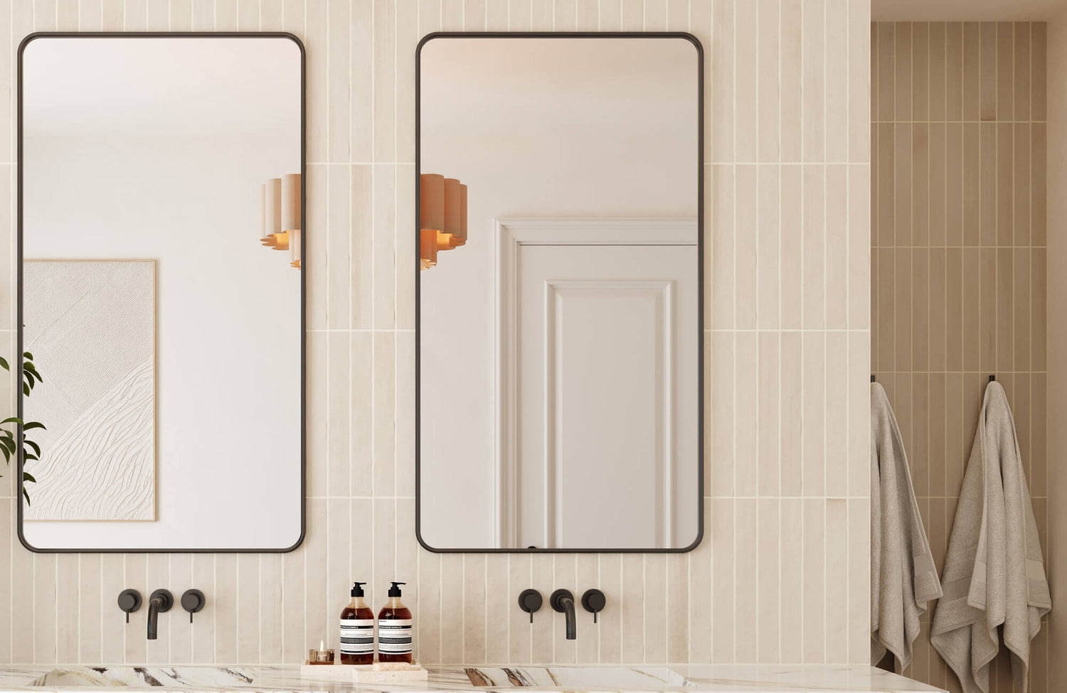 Cream vertical stripe tiles and framed dual mirrors with rounded edges in a modern double-sink vanity setup.