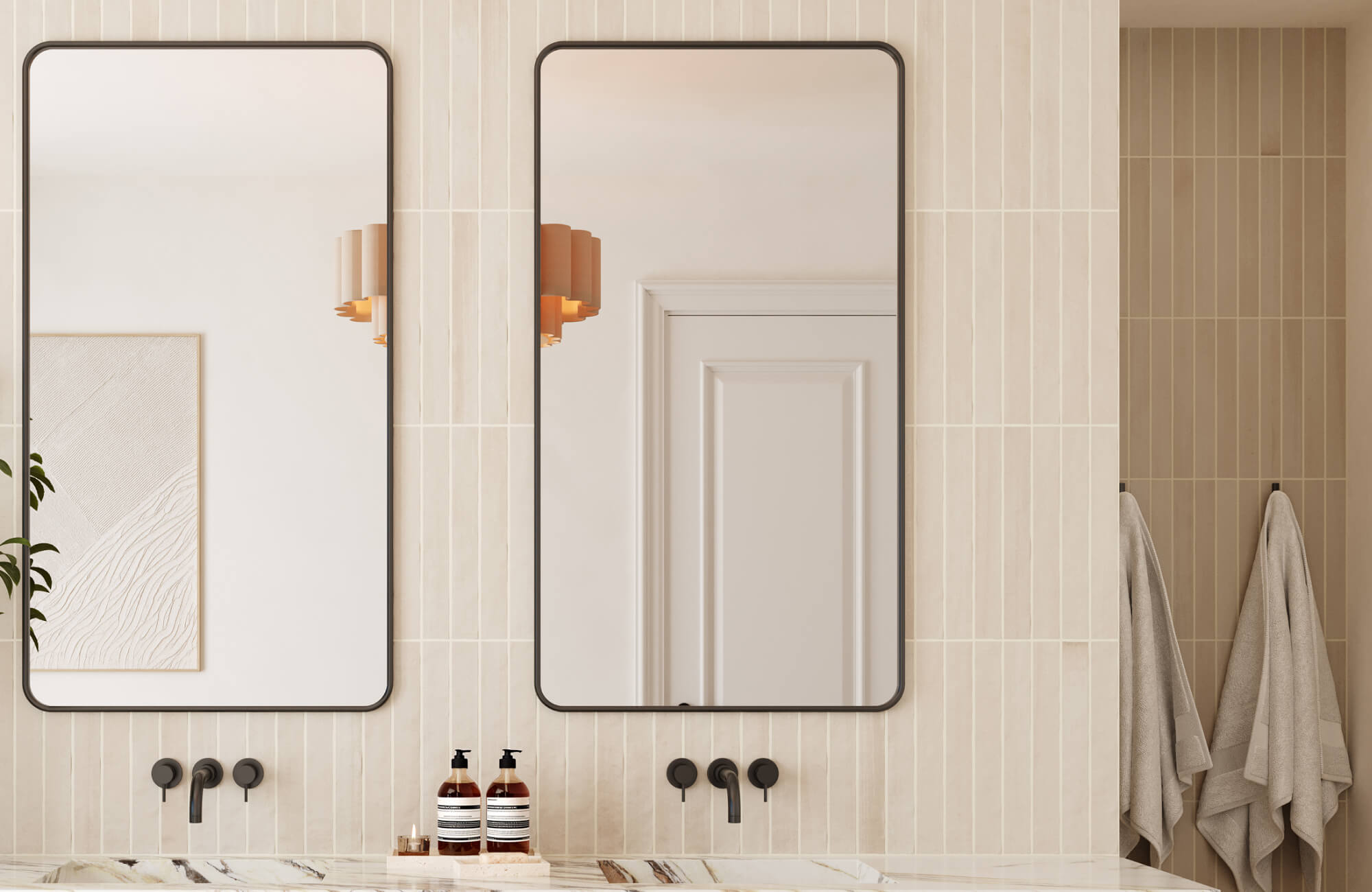 Cream vertical stripe tiles and framed dual mirrors with rounded edges in a modern double-sink vanity setup.