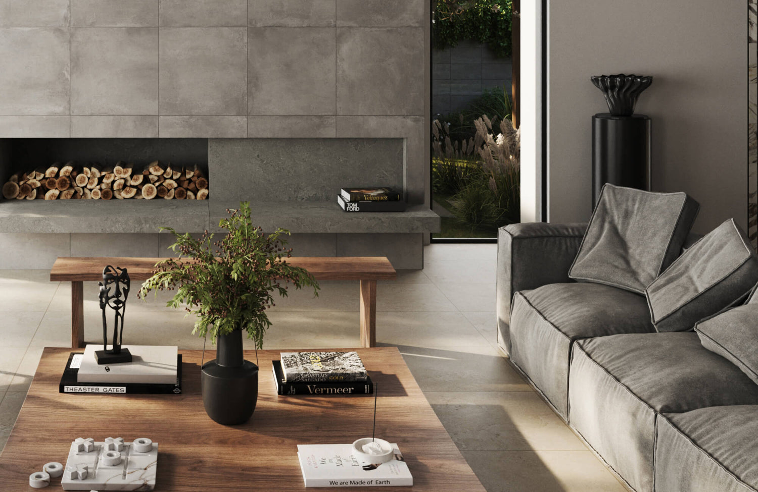Modern living room with gray sectional sofa and stylish gray throw pillows beside a contemporary concrete fireplace and wooden coffee table.