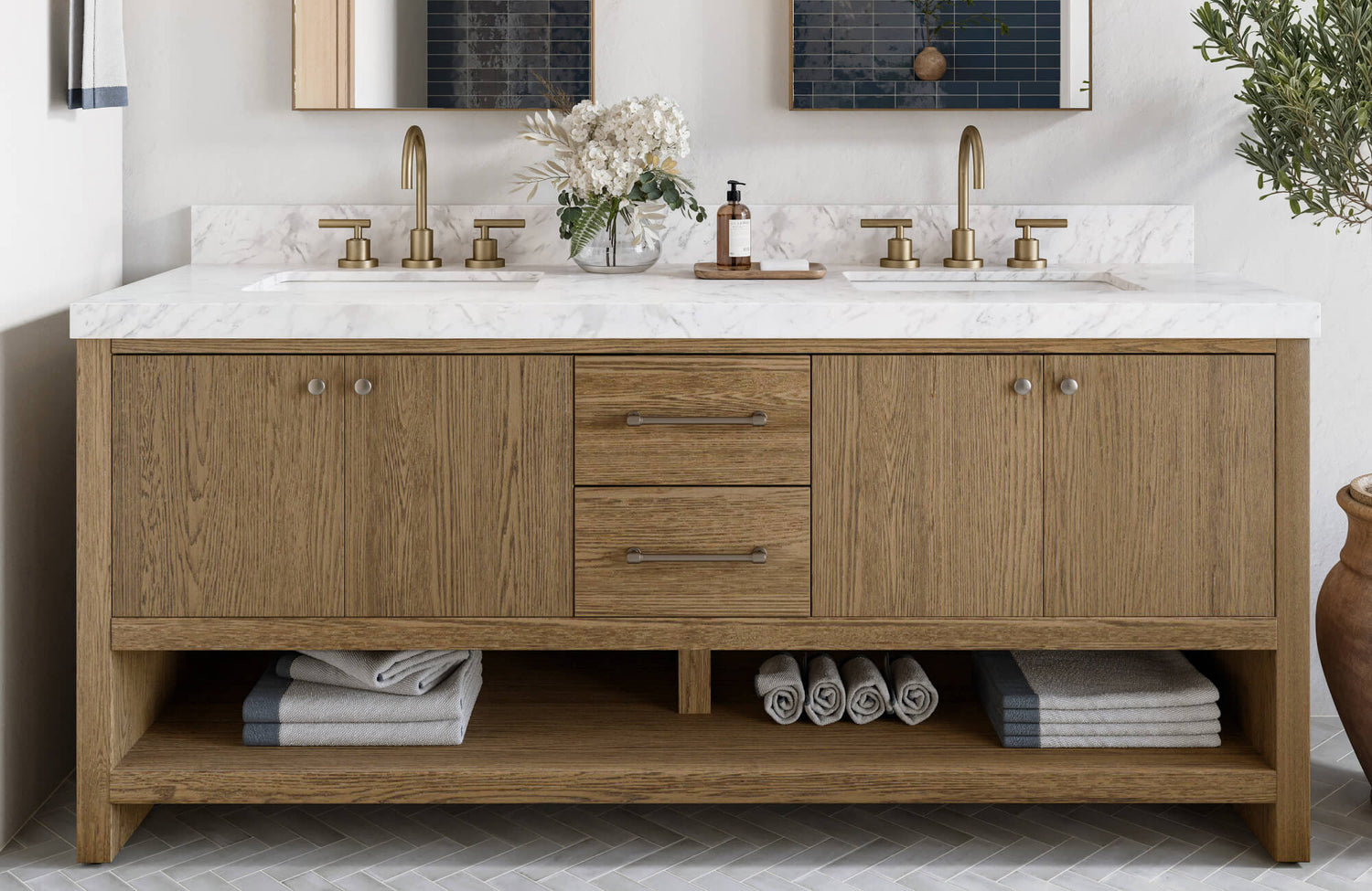 Sleek double sink vanity with warm oak cabinetry, white marble countertop, and matte brass fixtures.
