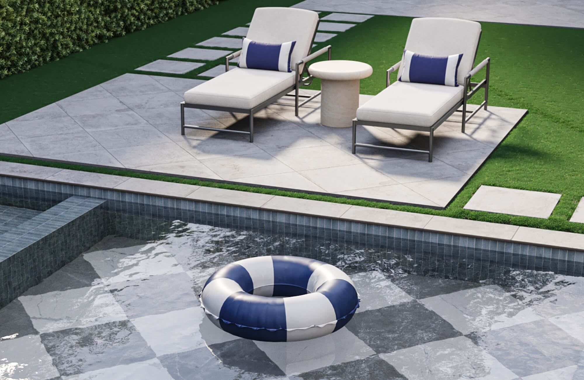 Modern poolside lounge with cushioned chaise chairs, a round outdoor end table, and checkerboard pool flooring.