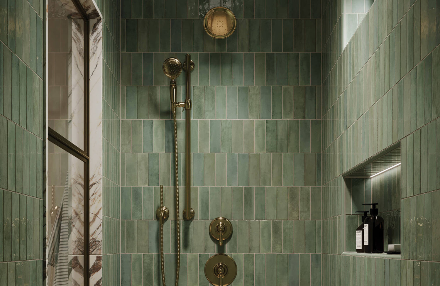 Green shower wall tiles with natural variation create a rich, earthy backdrop in a modern bathroom.