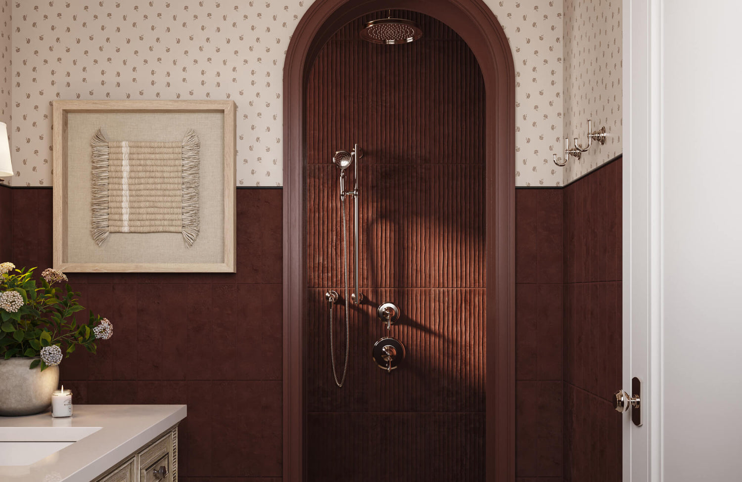 Framed woven textile wall art in neutral tones mounted above a vanity, adding texture and warmth to a tiled bathroom wall