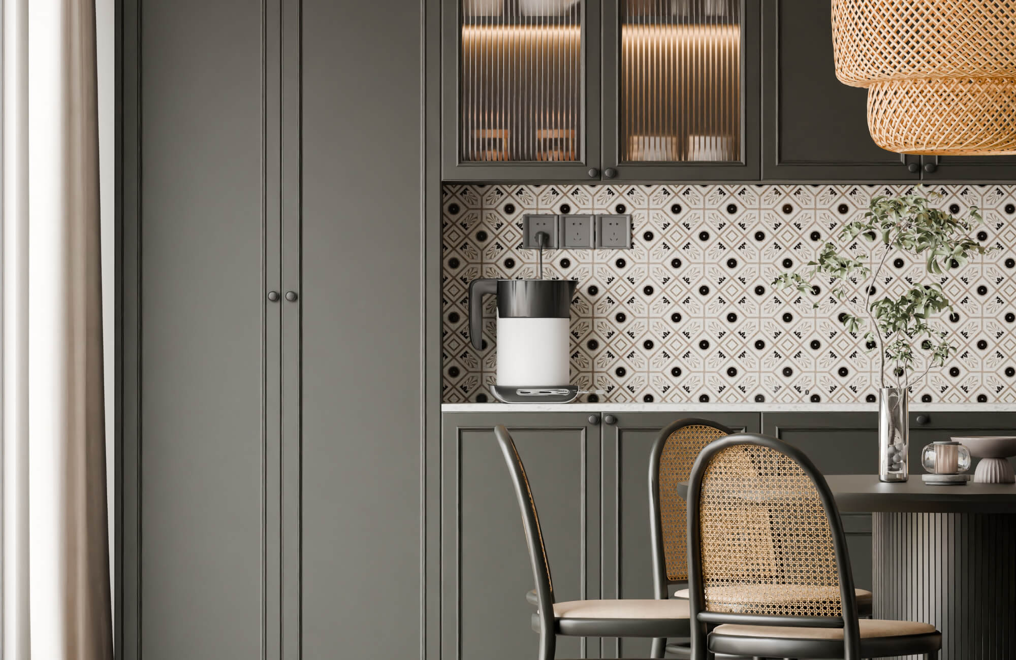 Modern kitchen with dark green cabinets, patterned tile backsplash, rattan dining chairs, and warm ambient lighting.