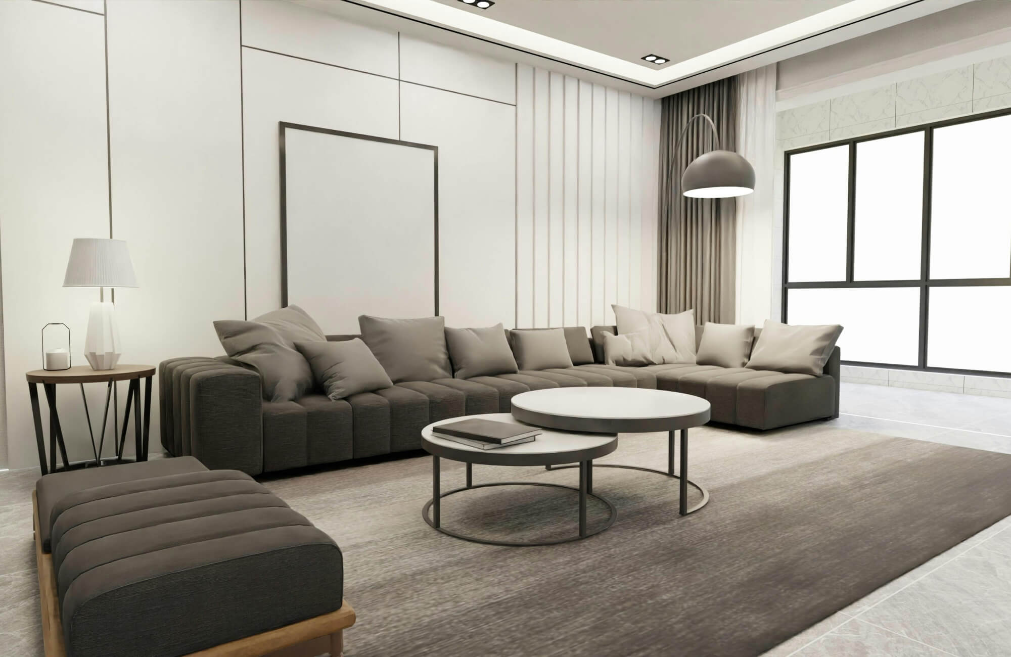 Modern living room with a large grey rug, sectional sofa, and layered round coffee tables under soft neutral lighting.