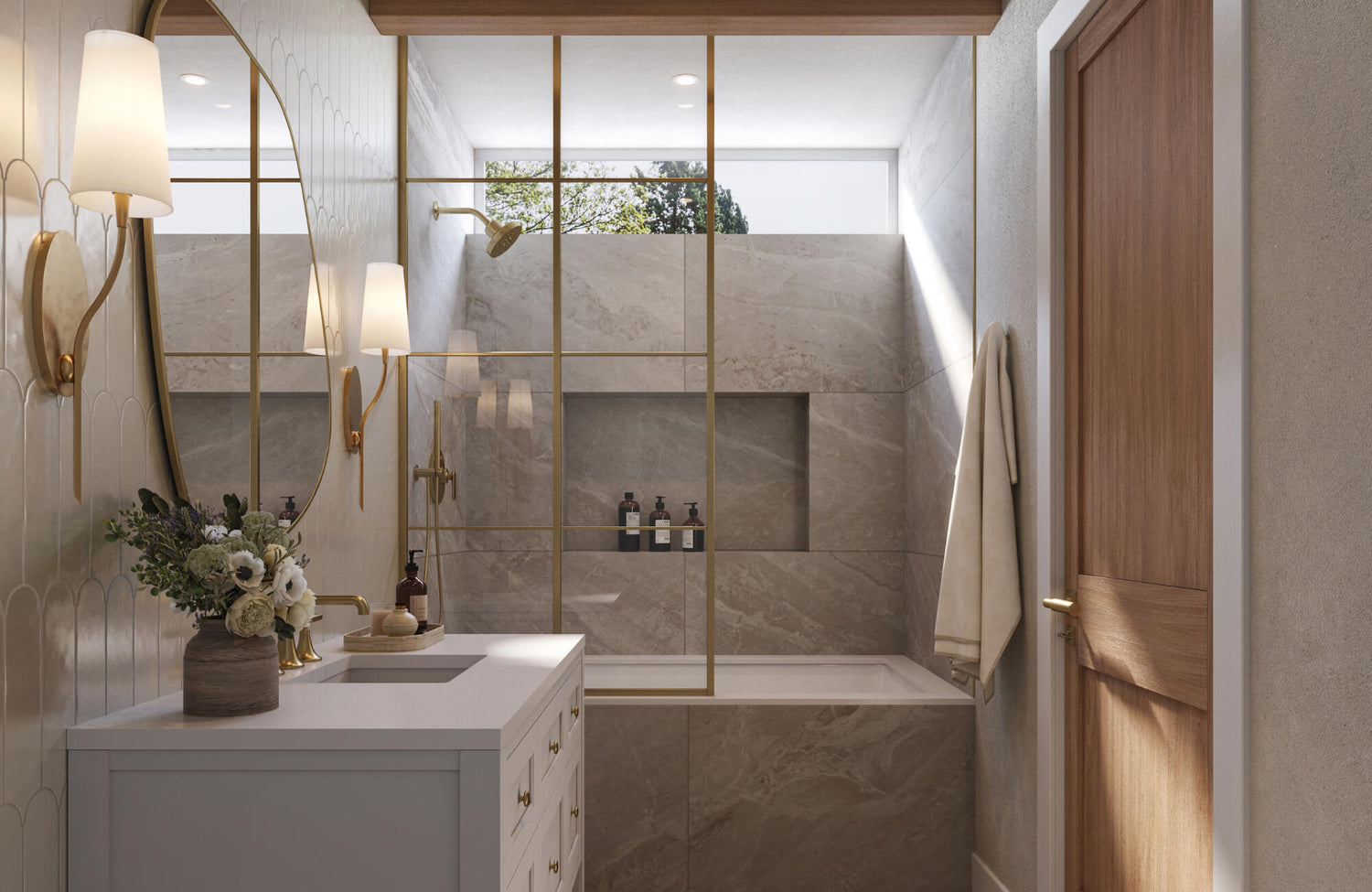 Modern bathroom with large beige marble-look shower tiles, gold-framed glass partition, white vanity, and wood door accents.