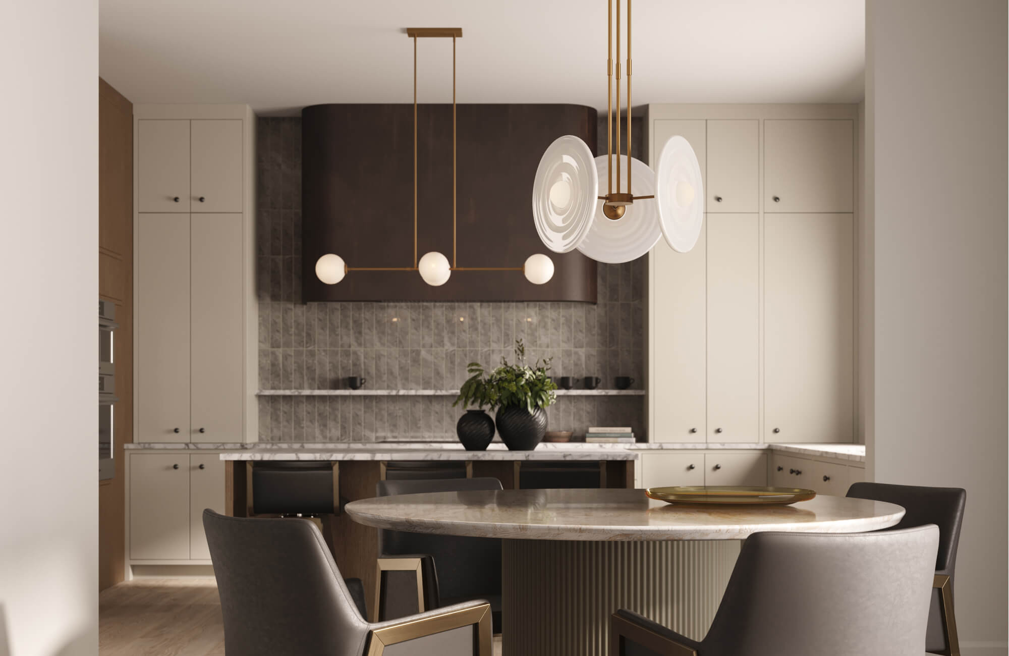 Warm modern kitchen with sculptural pendant lights, marble countertops, and vertical gray tile backsplash.