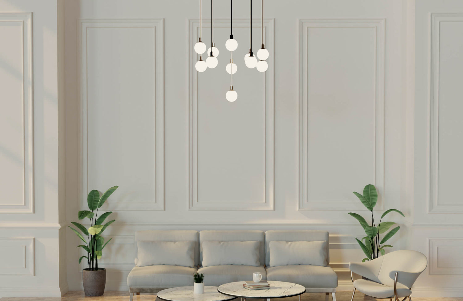 Elegant minimalist living room with soft globe pendant lighting, a neutral sofa, marble coffee tables, and lush potted plants adding natural balance.