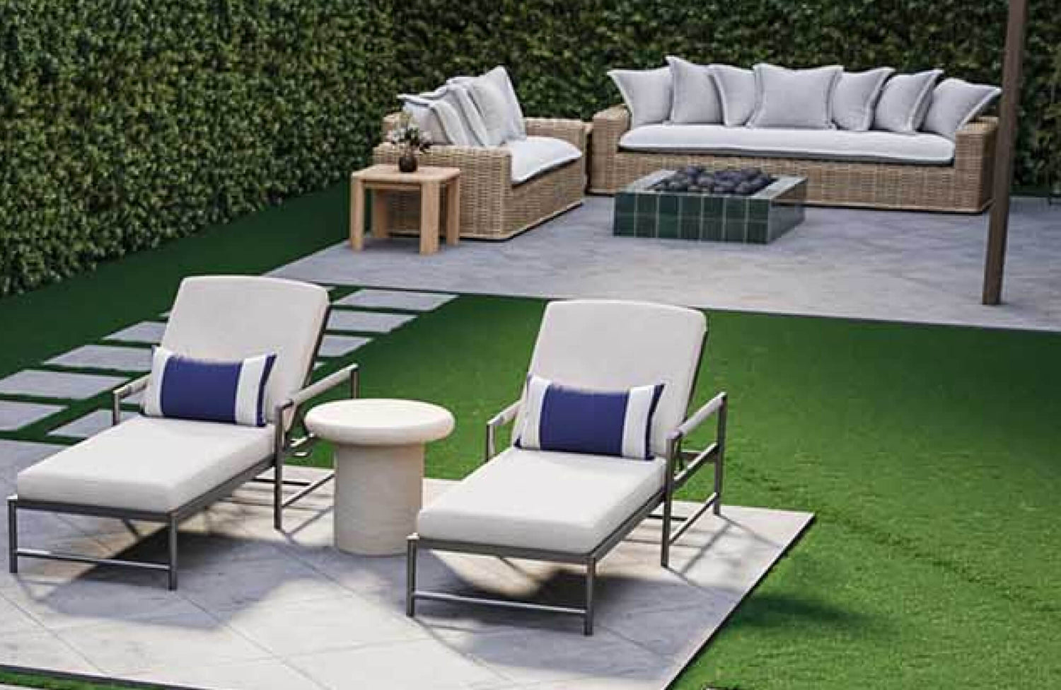 Outdoor pillow accents styled on modern poolside lounge chairs with woven patio seating and neutral outdoor cushions in a landscaped backyard.