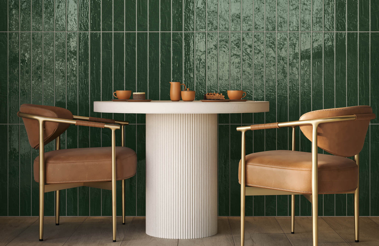 This outdoor dining set combines warm brown cushioned chairs, brushed brass detailing, and a ribbed ivory table, balanced by rich green handcrafted-style wall tiles.