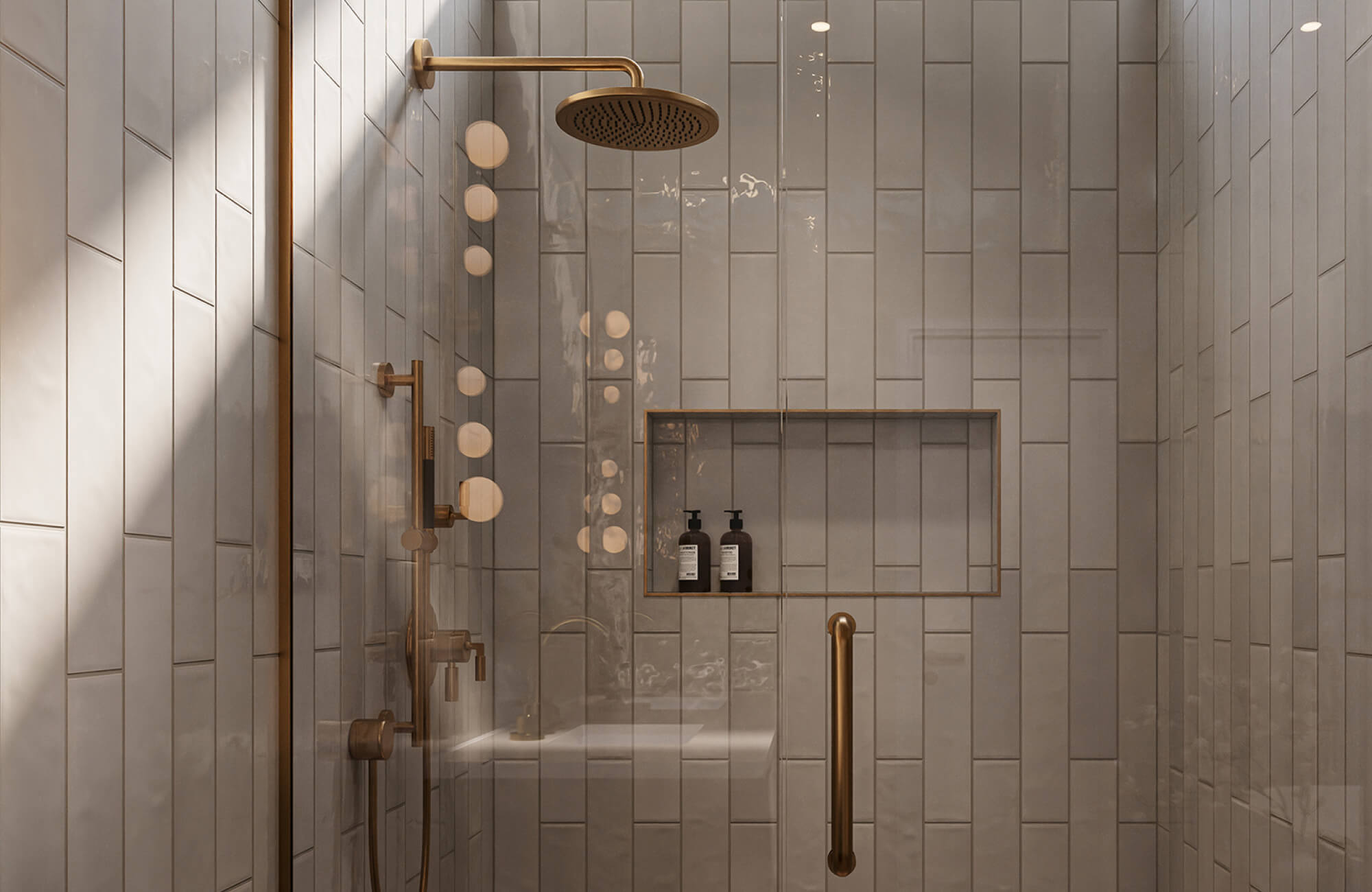Light gray vertical shower tiles with a soft glossy finish reflect warm light while minimizing visible water spots and streaks.