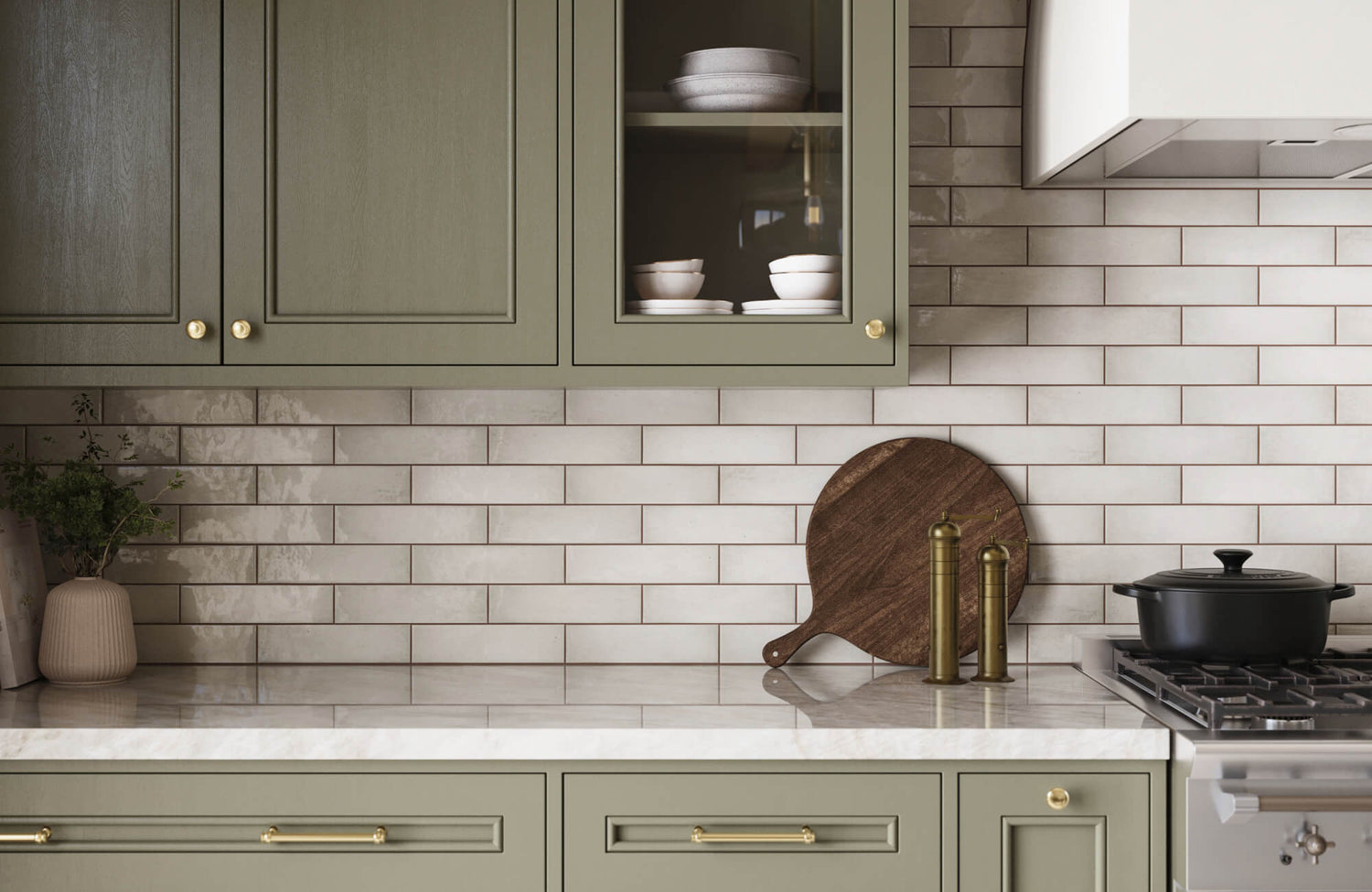 Soft beige subway tile backsplash with horizontal layout, subtle variation, and clean grout lines behind a classic cooking area