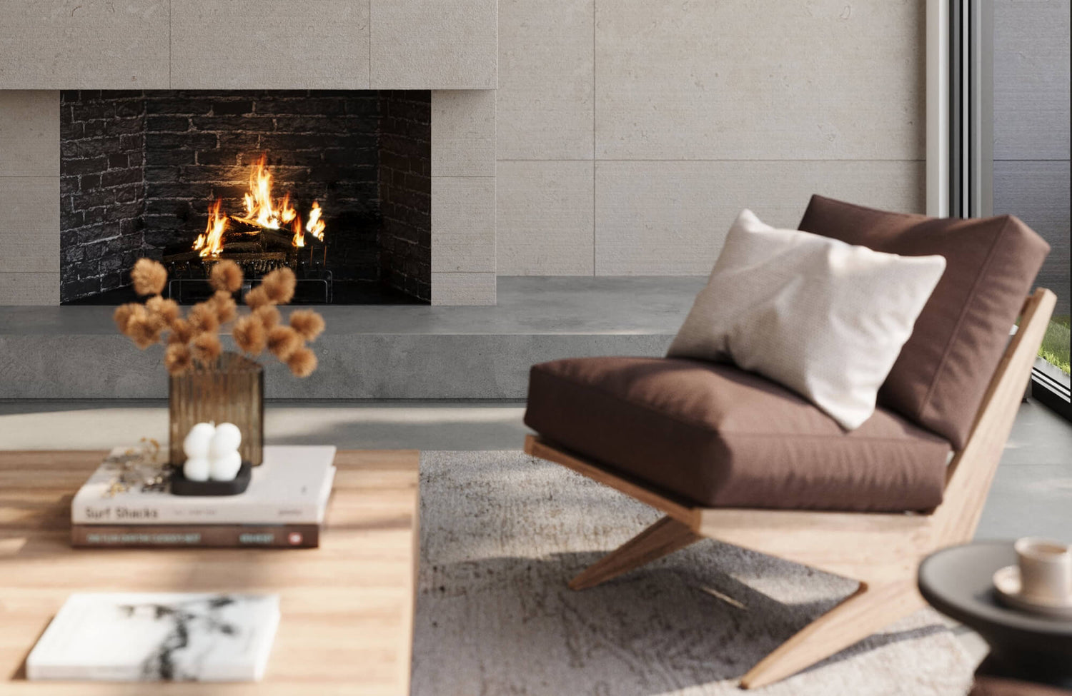Light stone-look fireplace surround with smooth, large-format tiles framing a dark brick firebox.