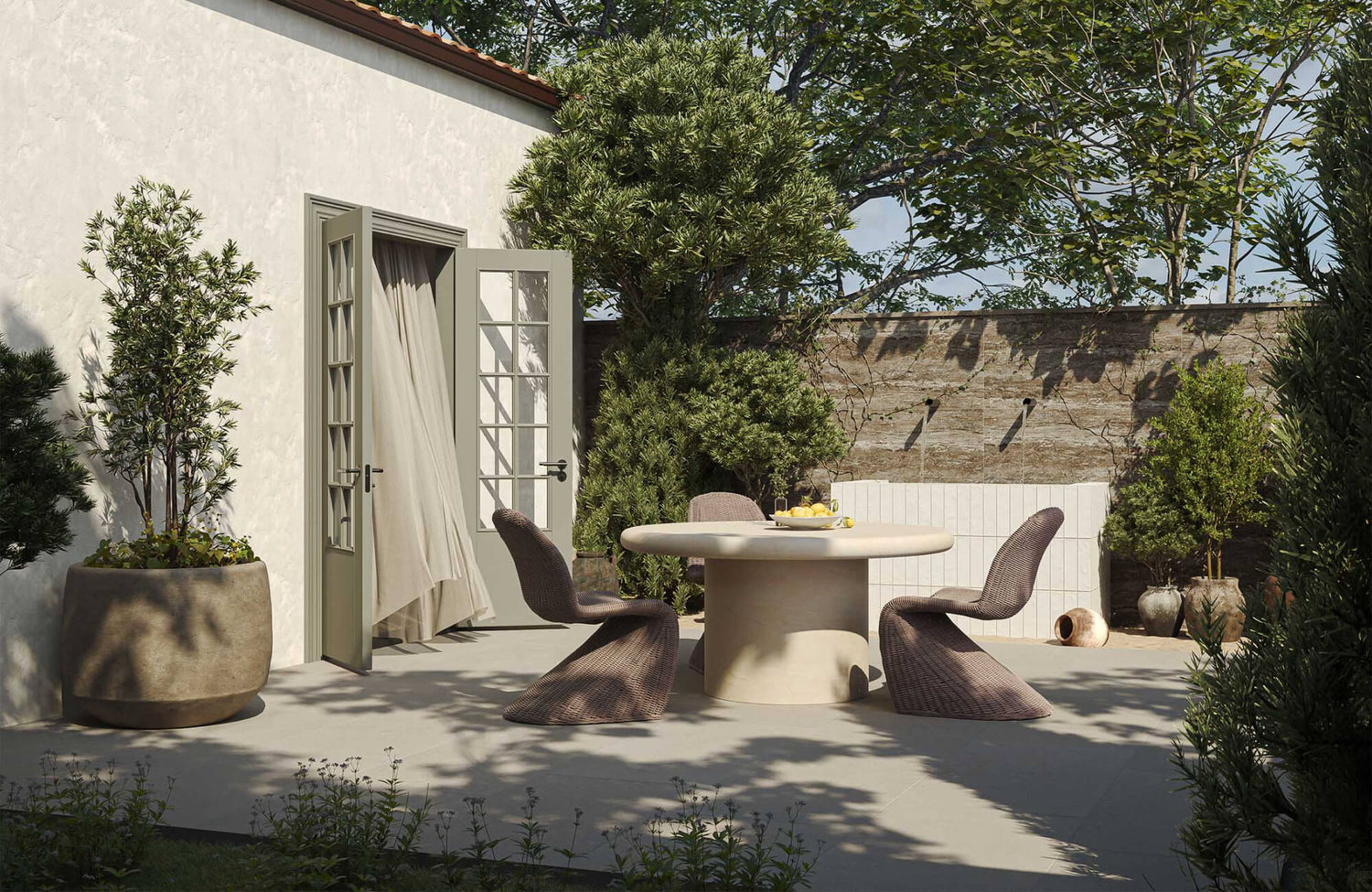 Outdoor patio dining setup with curved chairs and round table, illustrating space planning and layout considerations when choosing outdoor furniture