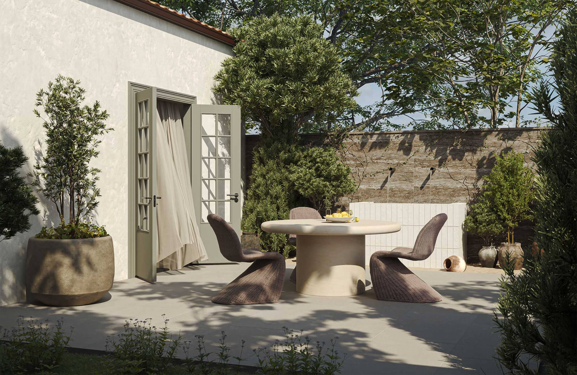 Outdoor patio dining setup with curved chairs and round table, illustrating space planning and layout considerations when choosing outdoor furniture