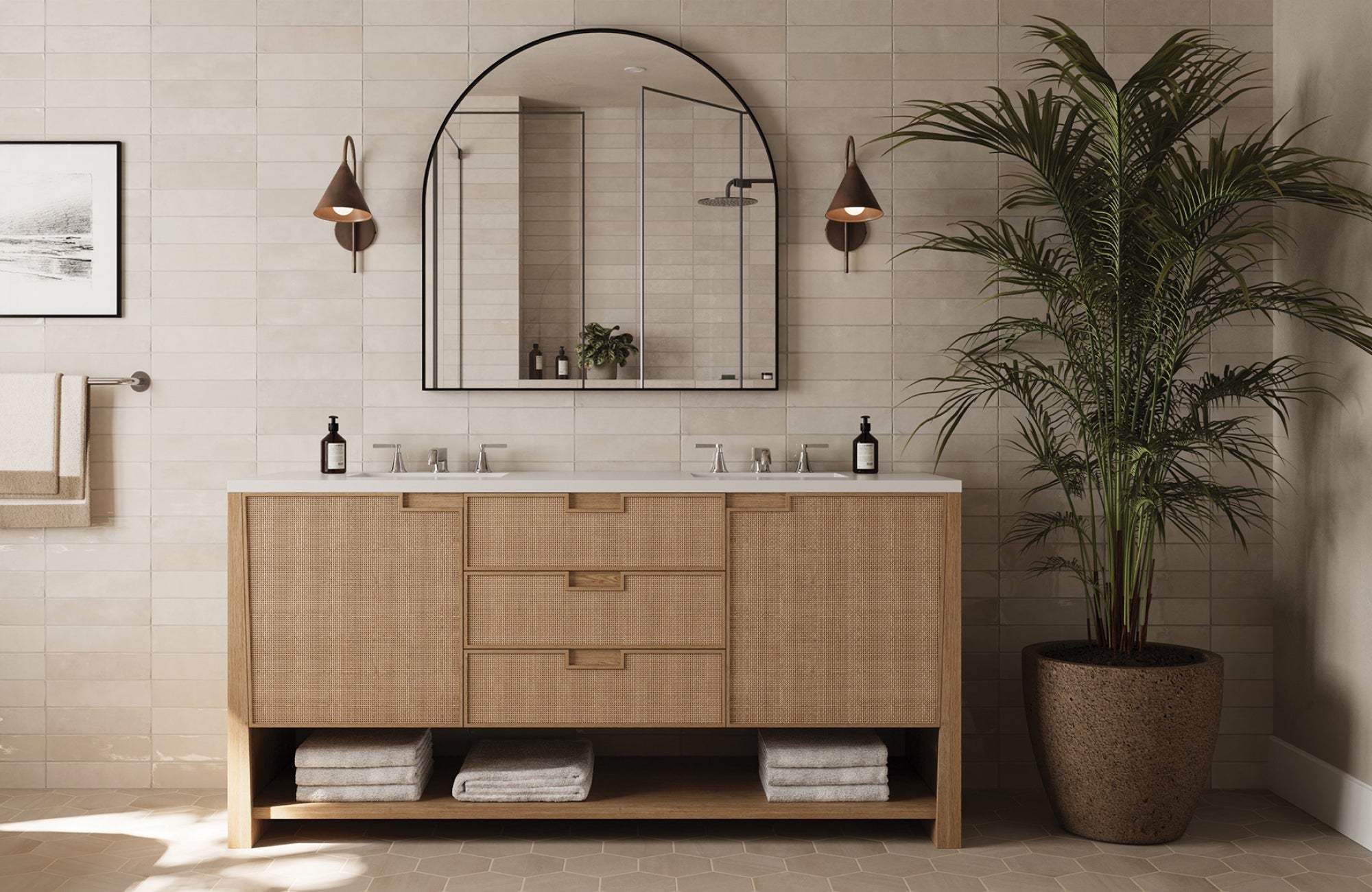 Arched matte black bathroom mirror above a double vanity with natural textures and neutral tile backdrop.