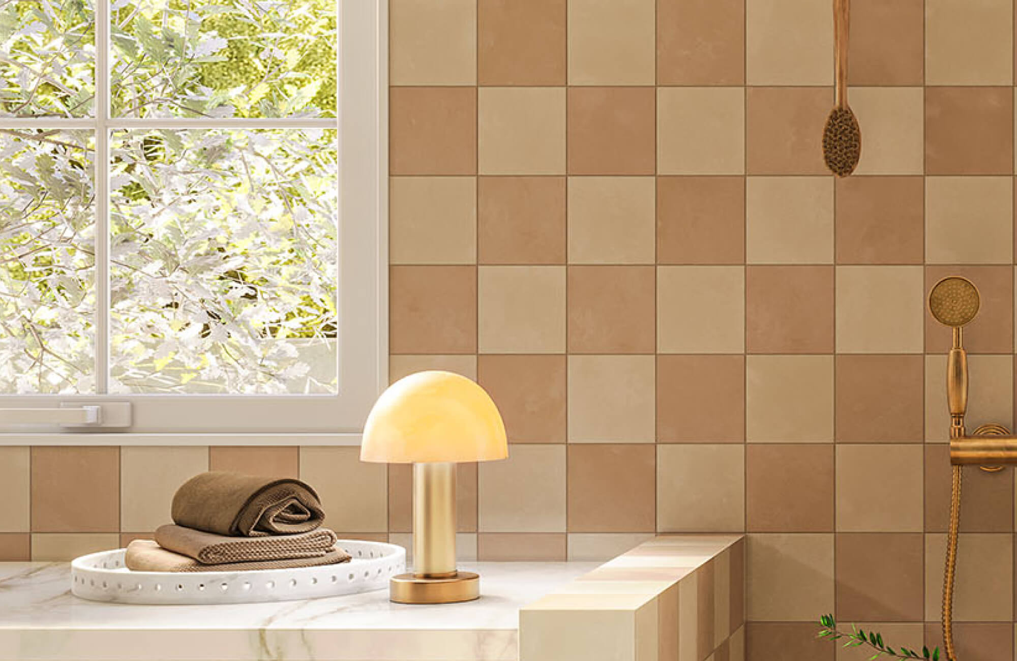 Washroom tub ledge styled with a white decorative tray holding folded towels, placed beside a small lamp for a warm, spa-like display.