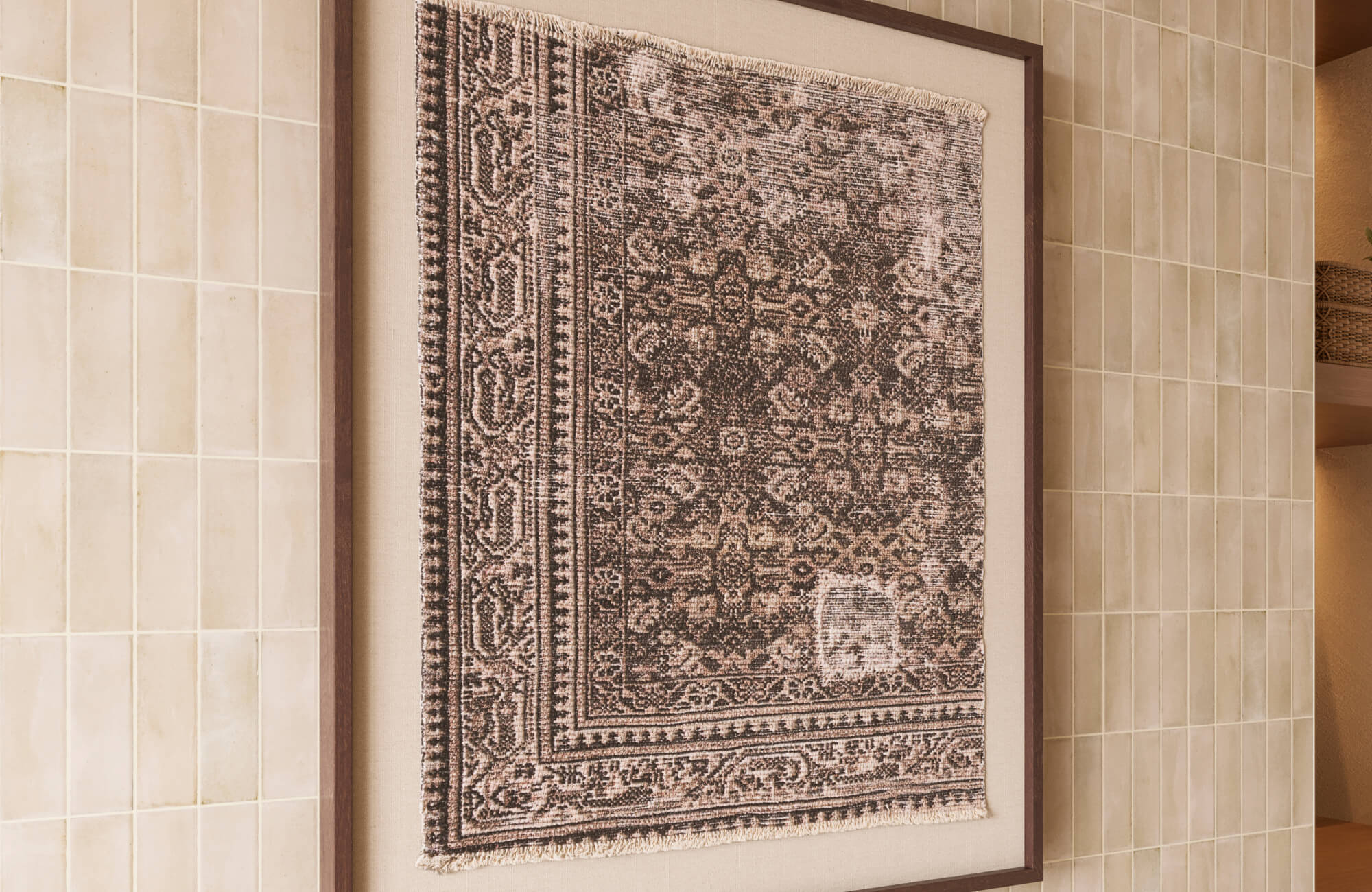Large framed wall art featuring a vintage-inspired woven textile pattern works beautifully above a bed, adding warmth and visual depth against soft neutral tile walls.