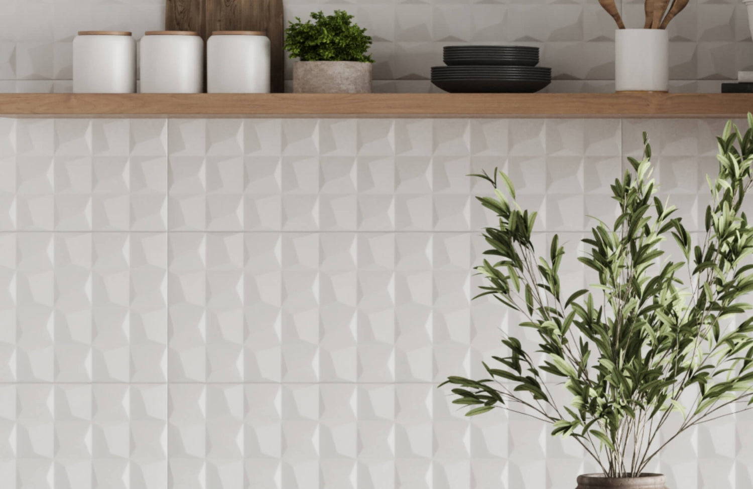 Sculpted white ceramic tiles with a geometric 3D pattern, adding depth and modern elegance to the kitchen wall.