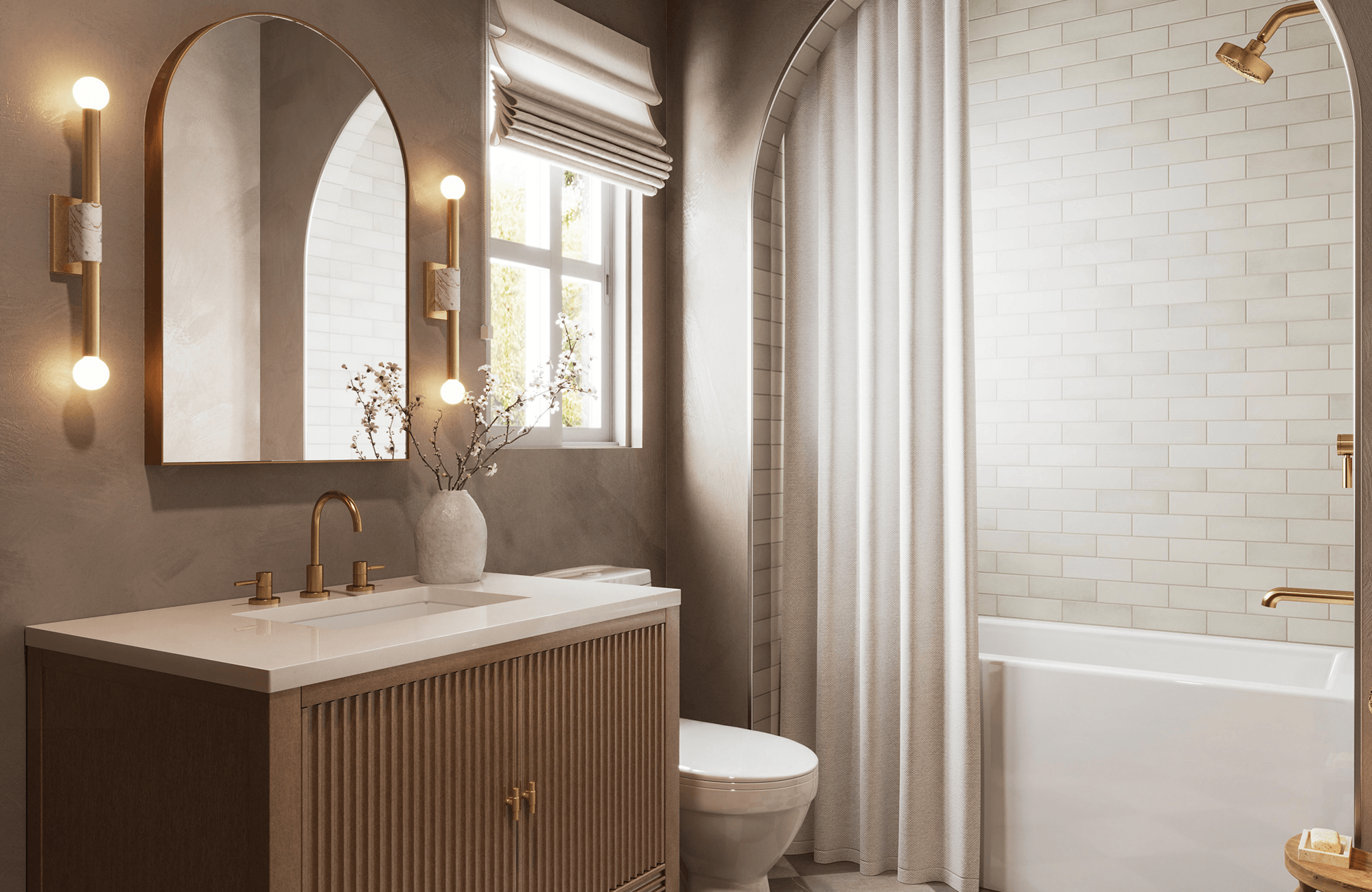 Modern brass wall sconces with cylindrical white accents and globe bulbs flank an arched mirror, casting a warm glow.