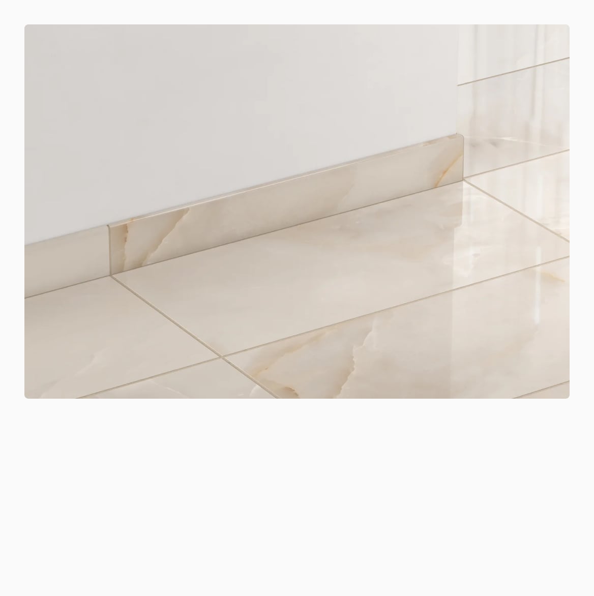 Elegant bullnose trim tiles perfectly match the floor tiles, framing the space with a polished, cohesive finish.