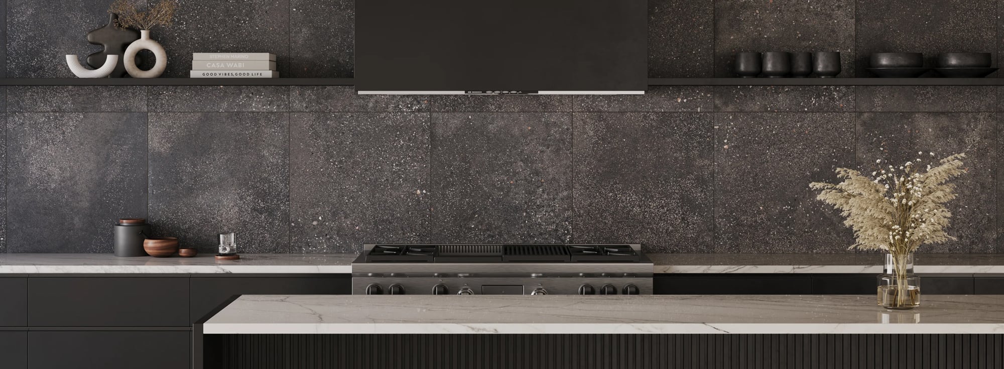 Chic dark grey tile backdrop in a modern kitchen adds depth and drama, accented by natural decor and marble countertops