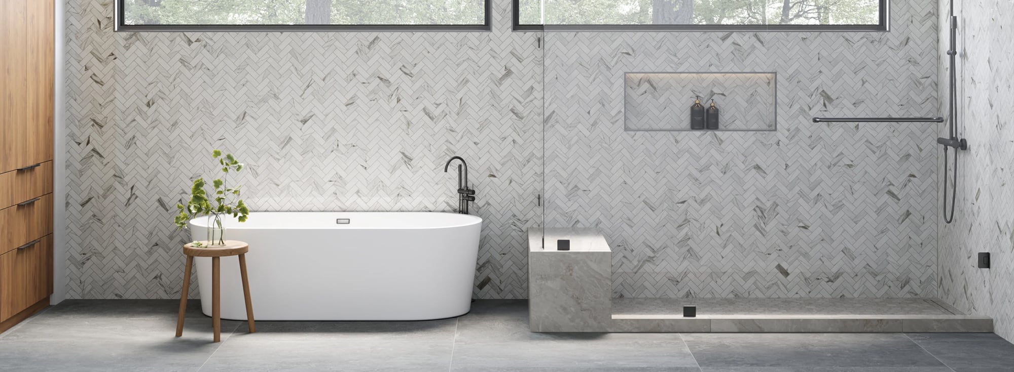 Elegant bathroom featuring light grey tile with herringbone pattern, creating a serene, contemporary retreat