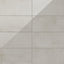 12x24 porcelain tiles featuring soft ivory and beige tones with a polished concrete finish for timeless elegance