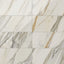 Polished Calacatta Cremo porcelain marble look tile in 12x24 format, featuring taupe and beige veining on a creamy white base for a luxurious finish.