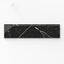 Leona Nero Marquina 3x12 bullnose polished tile showcases black marble with striking white veining, ideal for refined edge detailing.