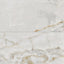 Astrid 24x48 matte porcelain tile in pearl, showcasing a soft white finish with delicate golden veining.