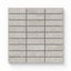 Adeline Taupe 1x4 Matte mosaic tiles showcasing a neutral taupe tone with a subtle textured surface, arranged in a linear pattern.