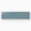 Glossy 3x10 bullnose tile in a deep bluish-teal tone, perfect for elegant transitions in coastal-inspired designs