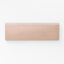 Soft blush matte bullnose tile in a 2.5x8 format, perfect for creating subtle, elegant accents
