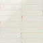 Subway porcelain tiles in soft white with a glossy surface and rustic brown edges.