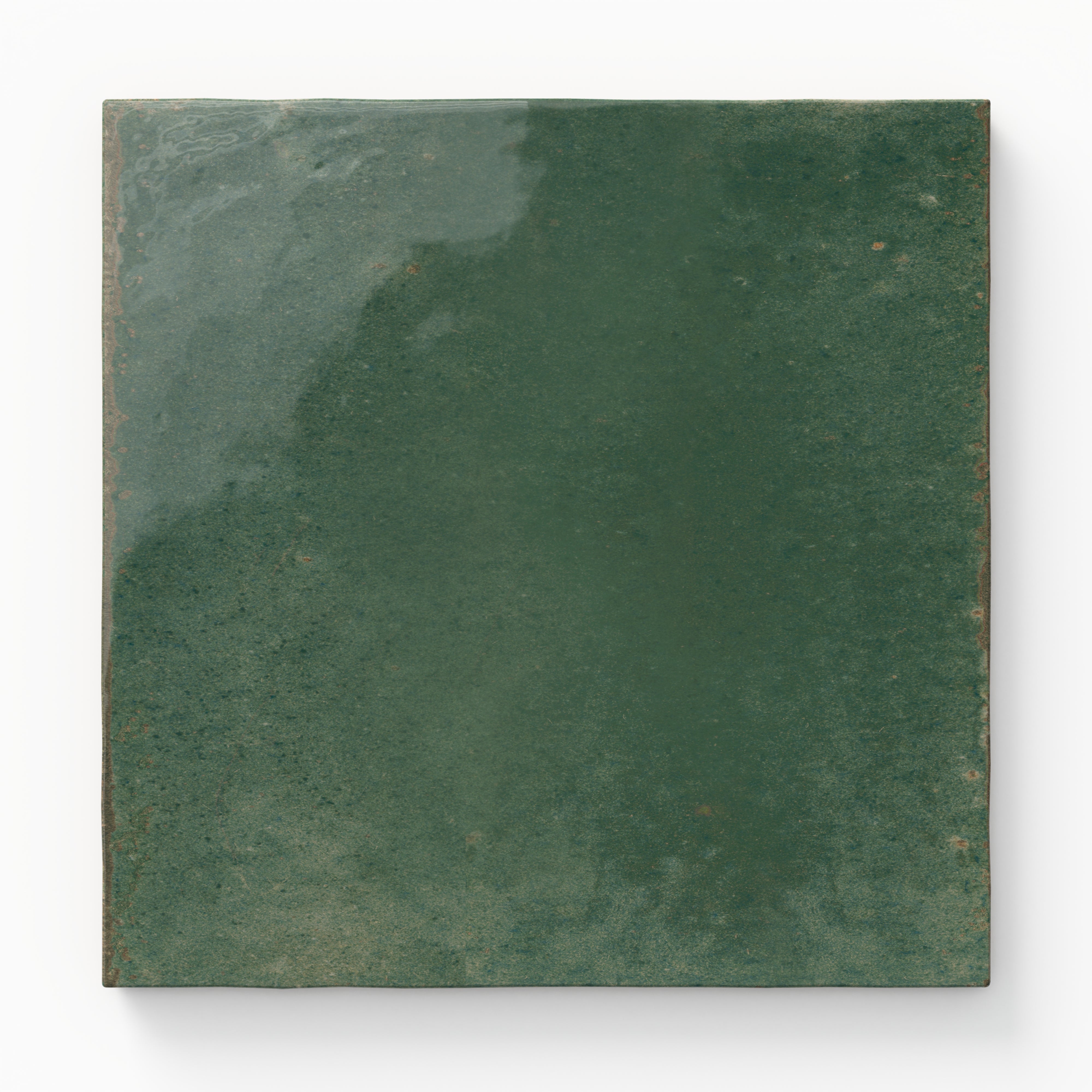 Square porcelain tile in a rich green tone with glossy finish and subtle tonal shifts for a handcrafted look.
