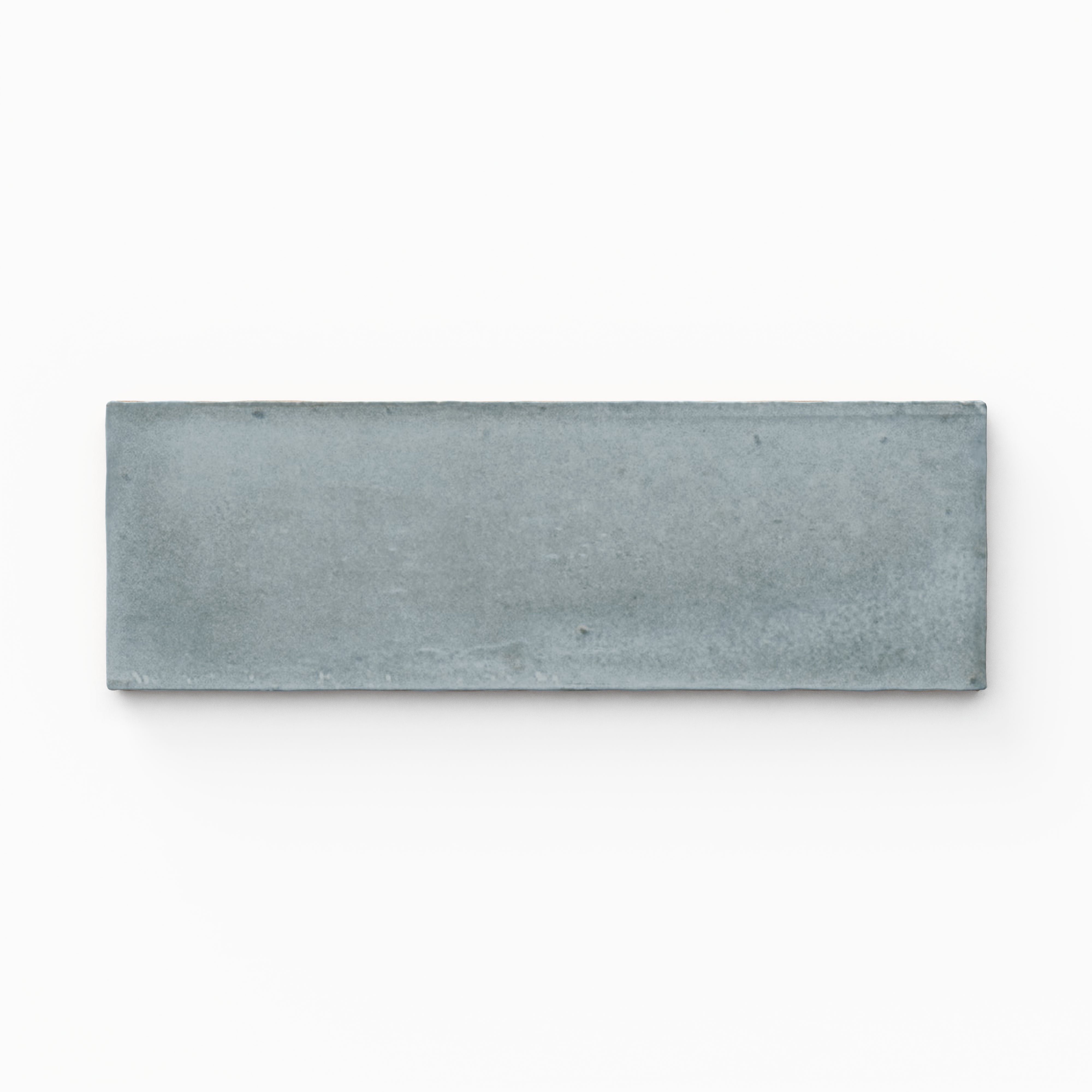 A 2x6 porcelain tile in light blue, featuring a matte finish, soft tonal variation, and a clean, flat-edge profile.