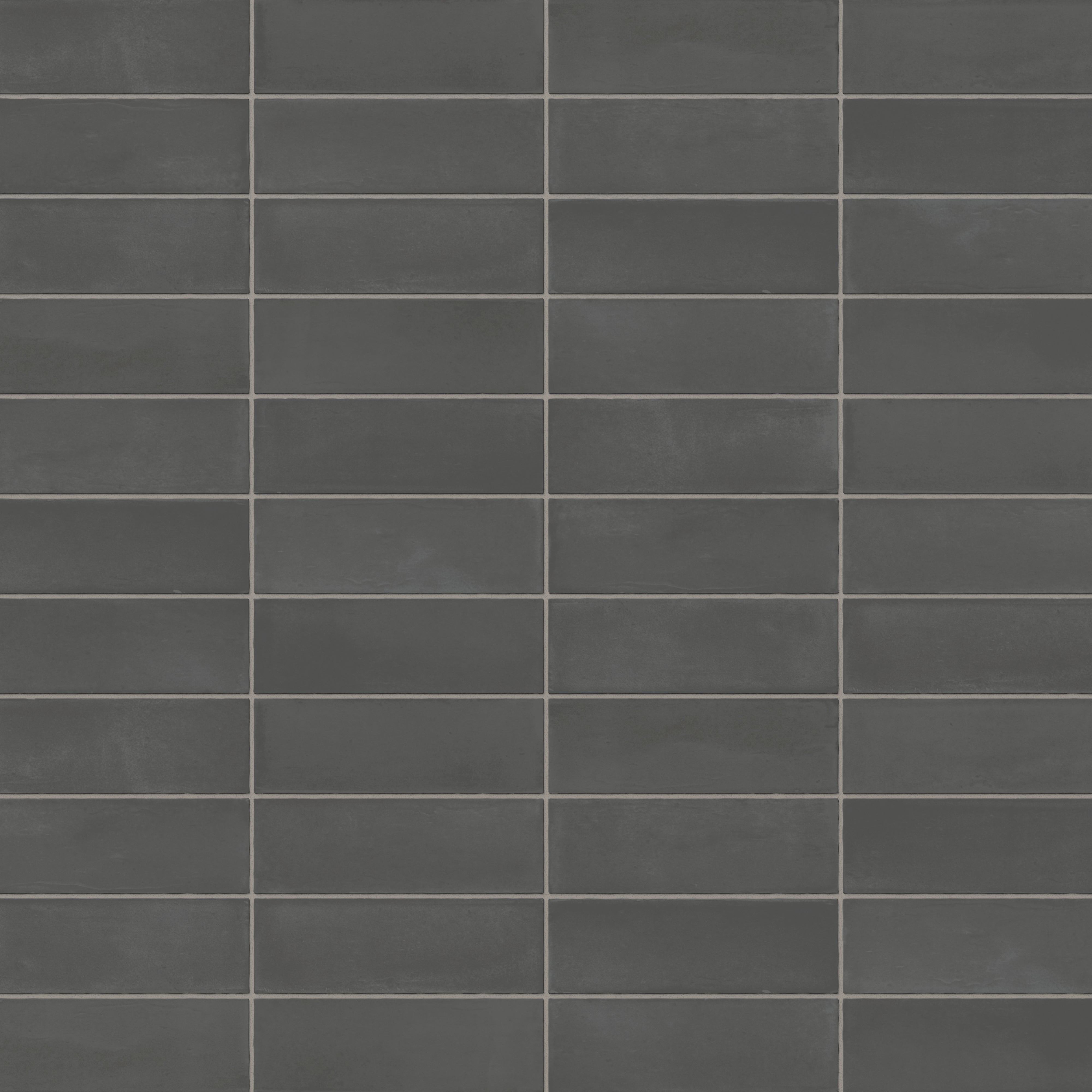 A 2x6 porcelain subway tile in dark gray, featuring a matte finish, and a clean stacked layout with fine grout lines.