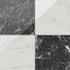 Blair 24x24 polished porcelain tile in white Carrara and Marmo black, creating a bold marble checkerboard contrast.
