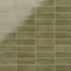 A 2x6 porcelain subway tile in moss green, featuring a glossy finish, and a clean stacked layout with fine grout lines.