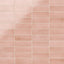 A 2x6 porcelain subway tile in soft pink, featuring a glossy finish, and a clean stacked layout with fine grout lines.