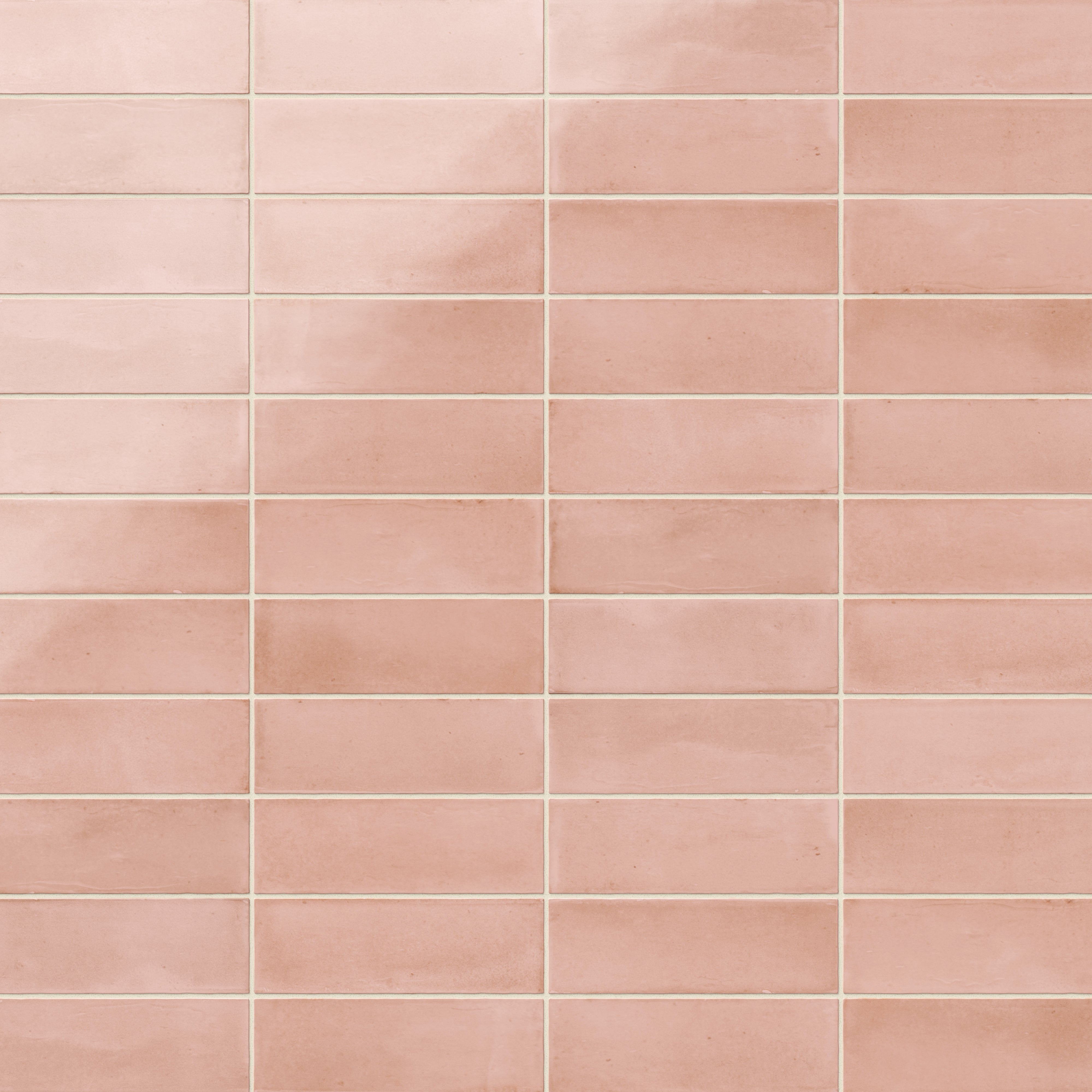 A 2x6 porcelain subway tile in soft pink, featuring a glossy finish, and a clean stacked layout with fine grout lines.