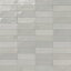 A 2x6.3 ceramic subway tile in light gray, featuring a glossy finish, and a clean stacked layout with fine grout lines.