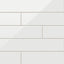 A 4x21 ceramic subway tile in white, featuring a glossy finish and staggered brick layout with fine grout lines.