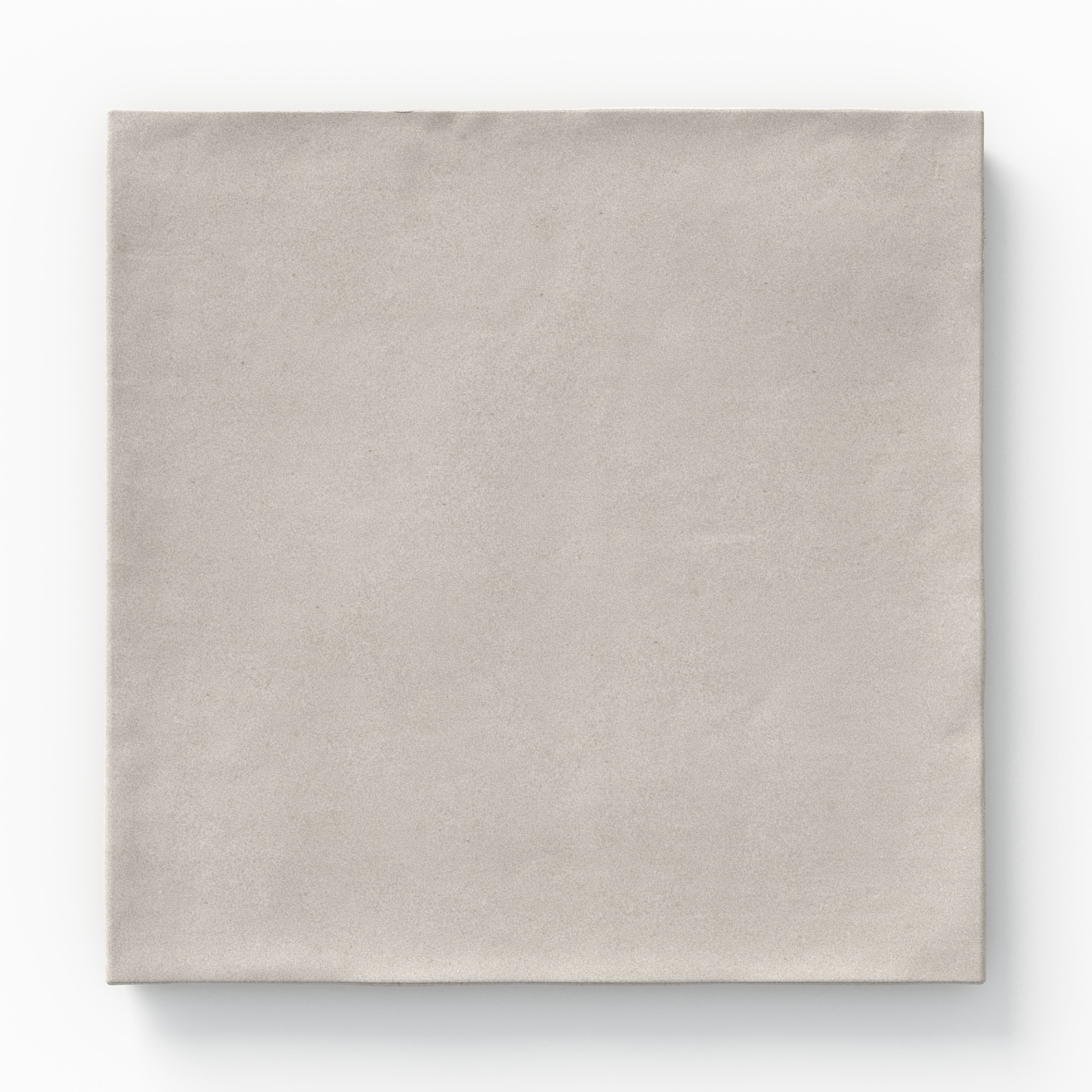 A 5.5x5.5 porcelain square tile in soft cool gray, featuring a matte finish, and a handcrafted, subtly textured surface.