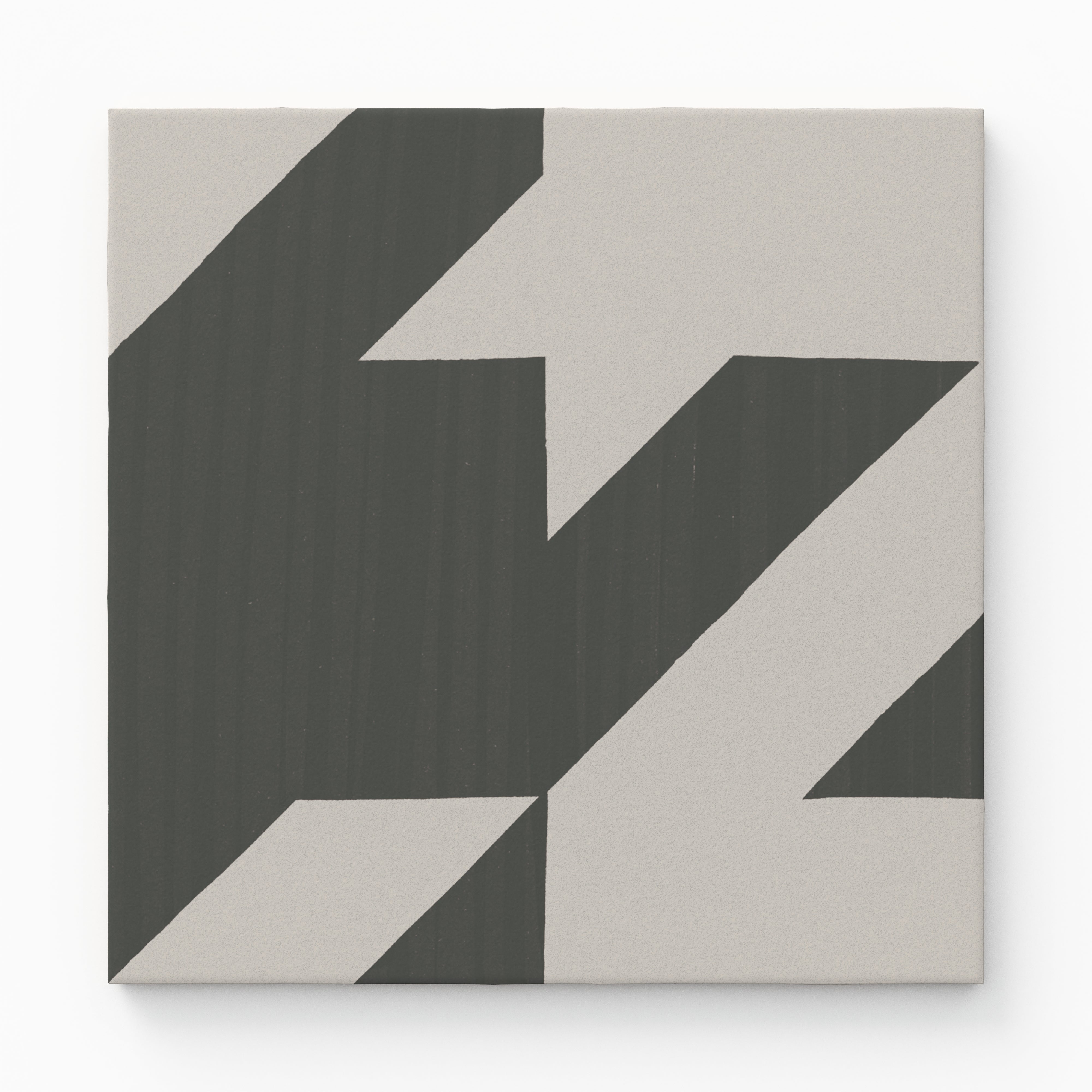 An 8x8 matte porcelain decorative tile with a striking dark and light gray zigzag pattern, evoking a modern, oversized houndstooth effect.