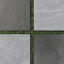 Charcoal and slate porcelain pavers with matte, stone-like surfaces, shown in a checkerboard pattern against green grass for a clean, modern outdoor setup.