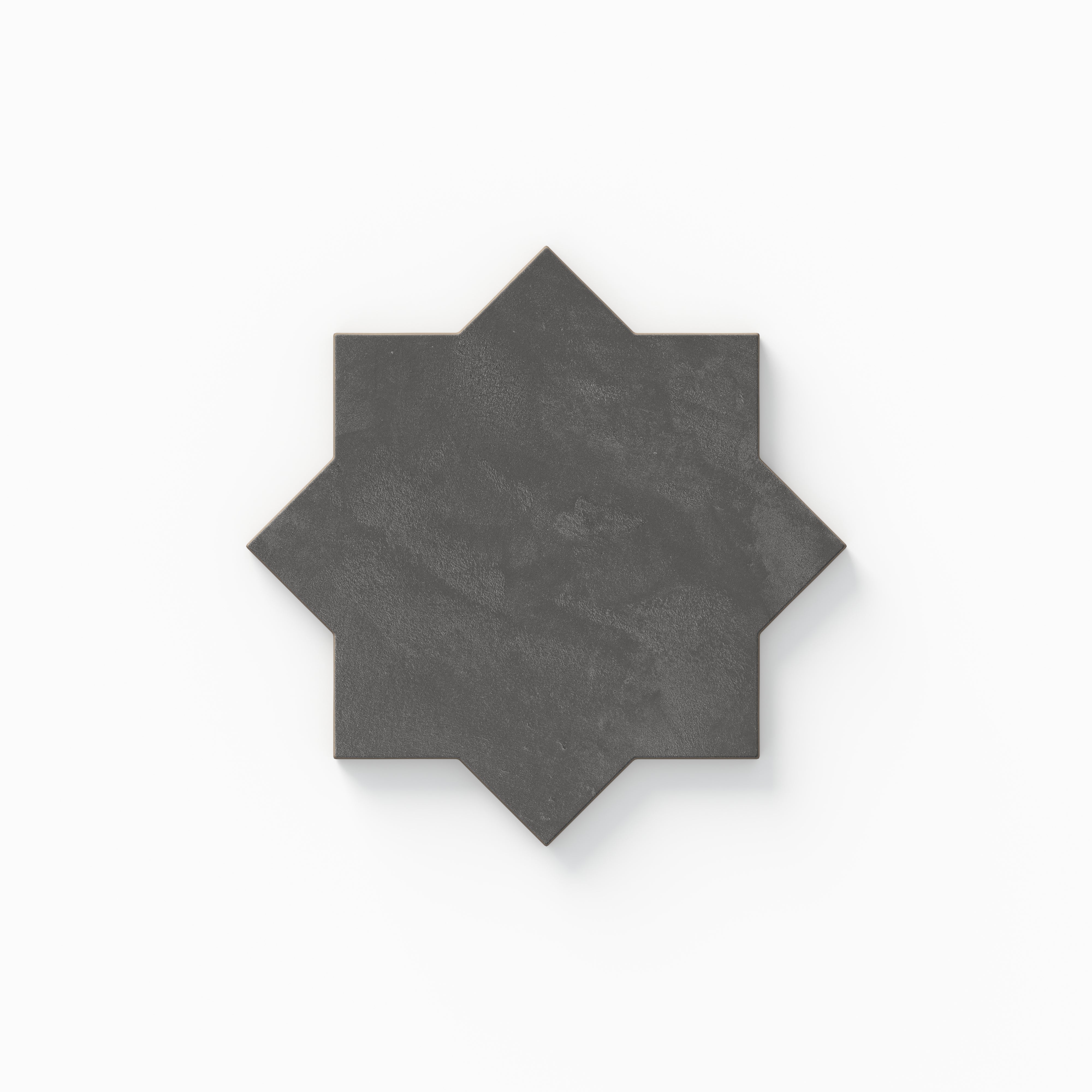 This eight-point star tile from our Isabel 11x11 Matte Porcelain collection highlights dark gray coloring, gentle plaster-like texture, and a powdery surface with an organically aged feel.