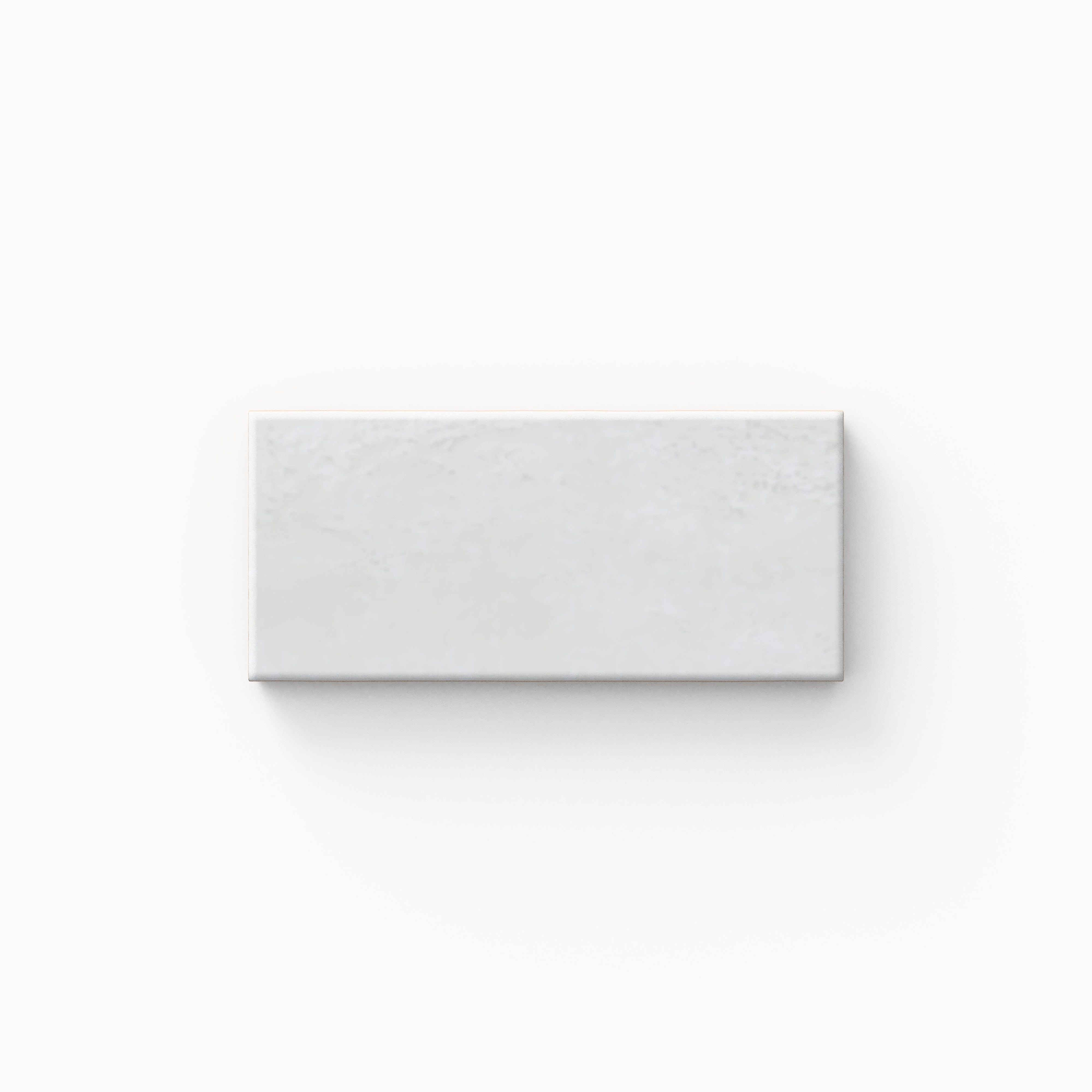 This glossy porcelain tile carries a luminous white finish with delicate surface depth, pairing naturally with coastal, minimalist, and light-filled contemporary homes.